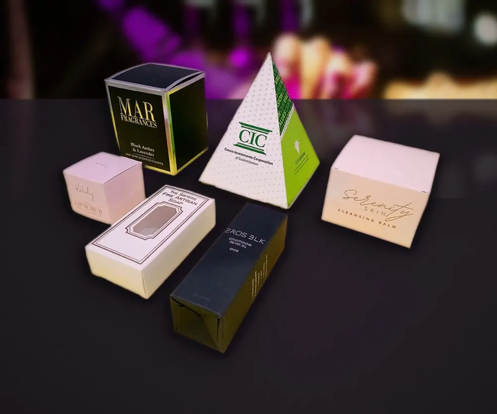 Premium cosmetic cartons on a dark display